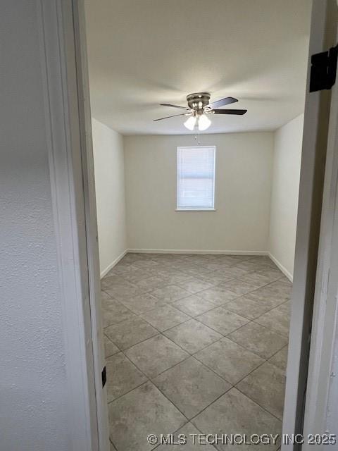 spare room featuring ceiling fan