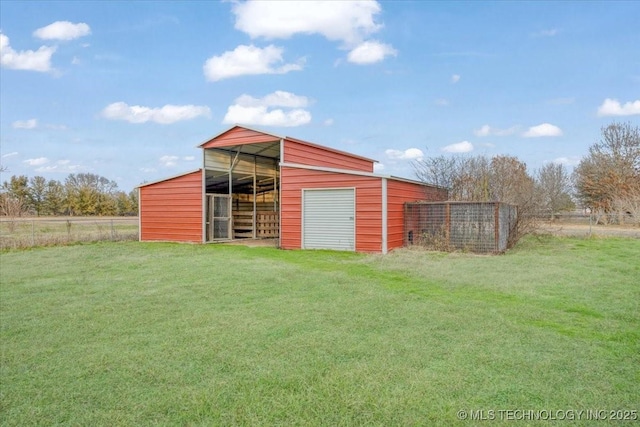 view of outbuilding with a lawn