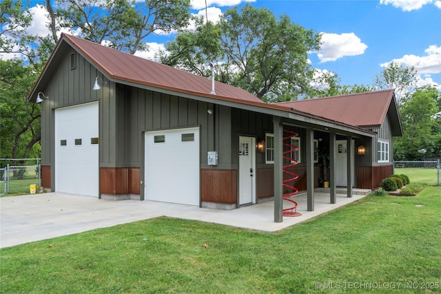 exterior space featuring a front lawn and a garage