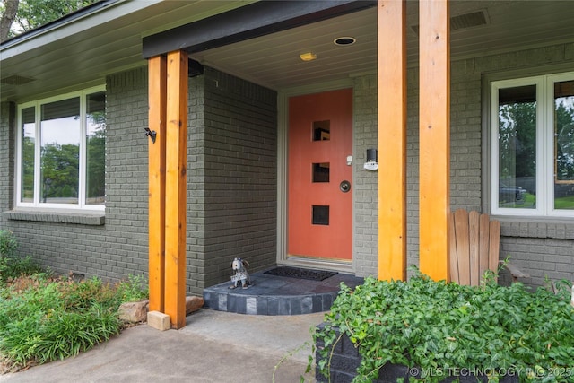 doorway to property with a porch