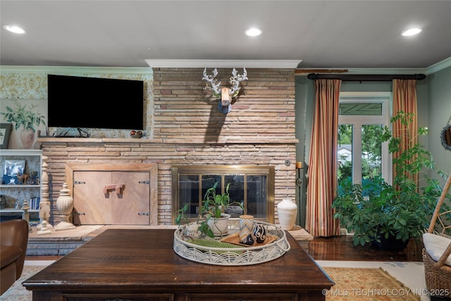 living room featuring a fireplace and ornamental molding