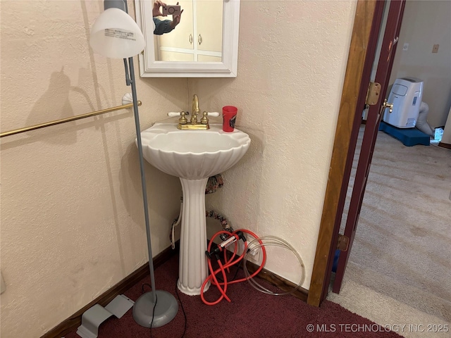 bathroom with a textured wall