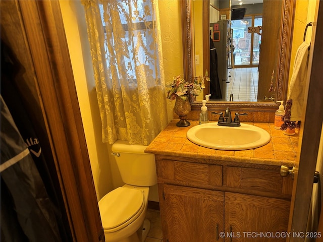 half bath with toilet and vanity