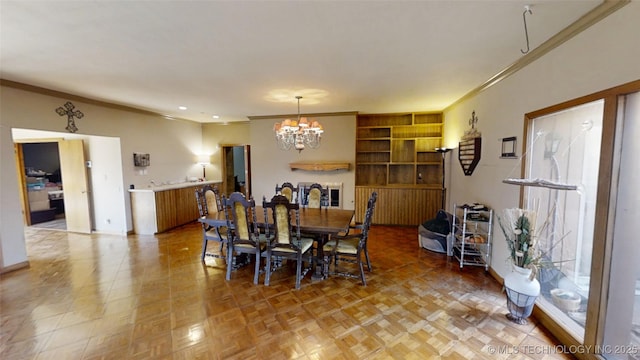 dining area featuring an inviting chandelier and ornamental molding