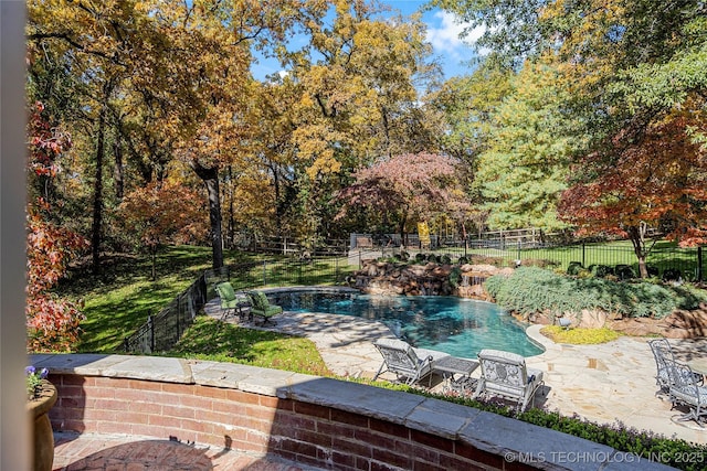 view of pool with a patio area