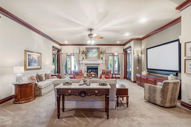 living room featuring light colored carpet, ceiling fan, and crown molding