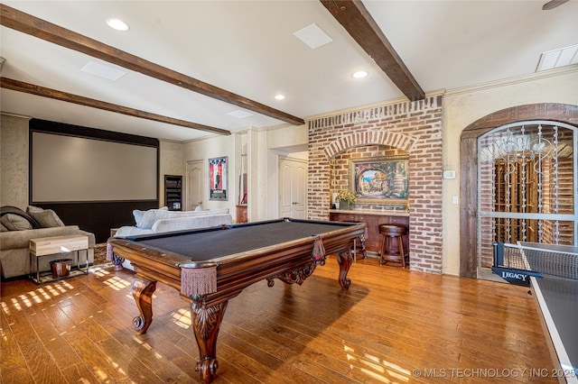 rec room featuring hardwood / wood-style flooring, beam ceiling, brick wall, and billiards