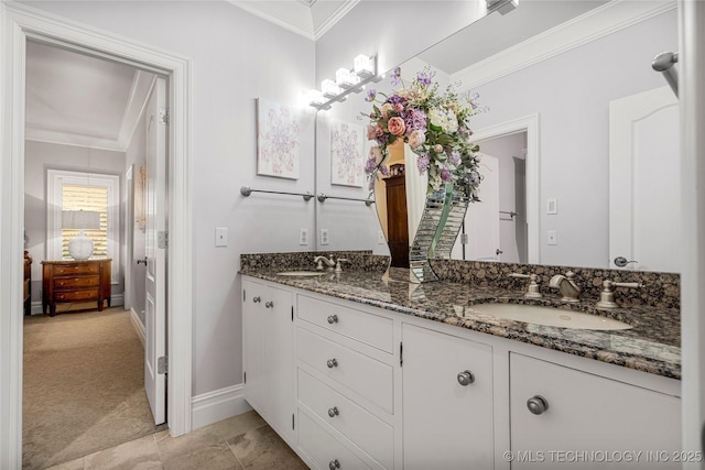 bathroom with vanity and crown molding