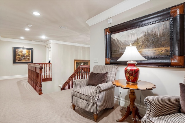 living area with carpet flooring and crown molding