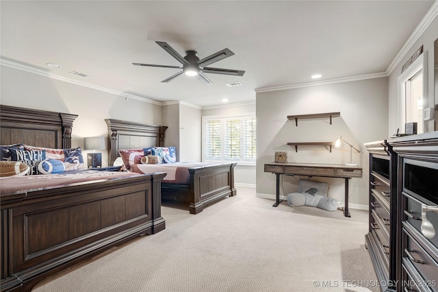 carpeted bedroom featuring ceiling fan and ornamental molding