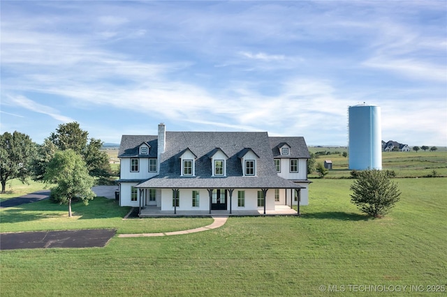 view of front of property with covered porch and a front lawn