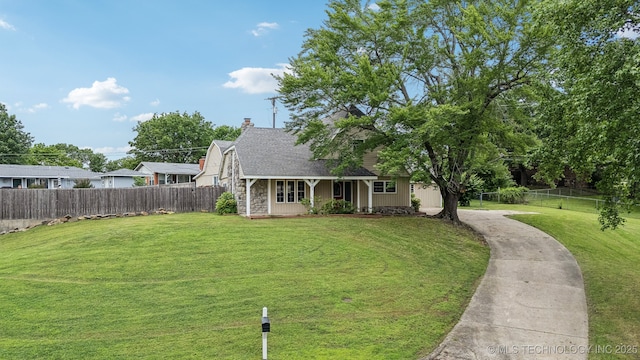 201 Sandy Cir, Tahlequah, OK 74464 - view of front facade with covered porch, stone siding, a chimney, and roof with shingles