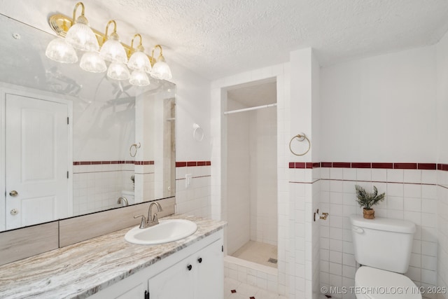 201 Sandy Cir, Tahlequah, OK 74464 - bathroom with tile walls, vanity, a stall shower, toilet, and a chandelier