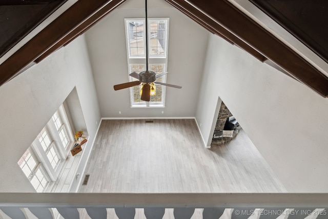 201 Sandy Cir, Tahlequah, OK 74464 - unfurnished living room with high vaulted ceiling, wood finished floors, and ceiling fan