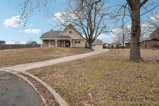 view of front of house featuring covered porch and a front lawn