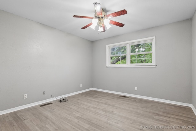 201 Sandy Cir, Tahlequah, OK 74464 - empty room featuring a ceiling fan, wood finished floors, and baseboards