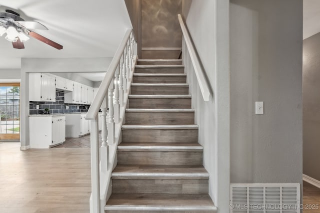 201 Sandy Cir, Tahlequah, OK 74464 - stairway with a ceiling fan and wood finished floors