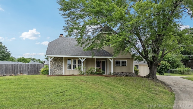 201 Sandy Cir, Tahlequah, OK 74464 - view of front facade with stone siding, roof with shingles, a chimney, covered porch, and concrete driveway