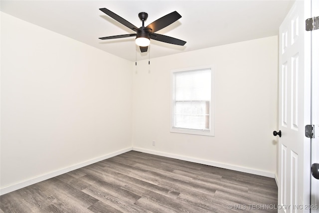 unfurnished room featuring dark hardwood / wood-style floors and ceiling fan