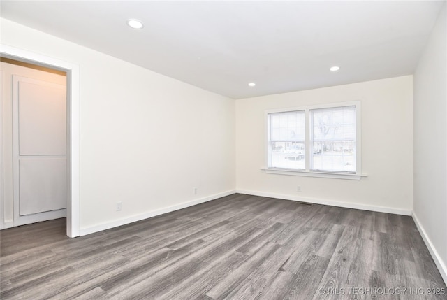 empty room featuring wood-type flooring