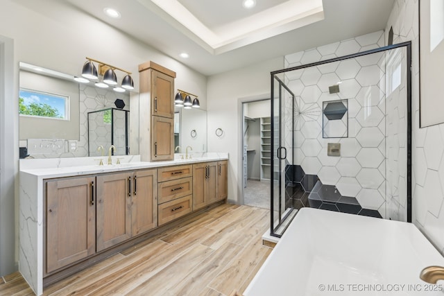 425 W Ft Worth St, Broken Arrow, OK 74012 - bathroom featuring a sink, recessed lighting, wood finished floors, and a stall shower