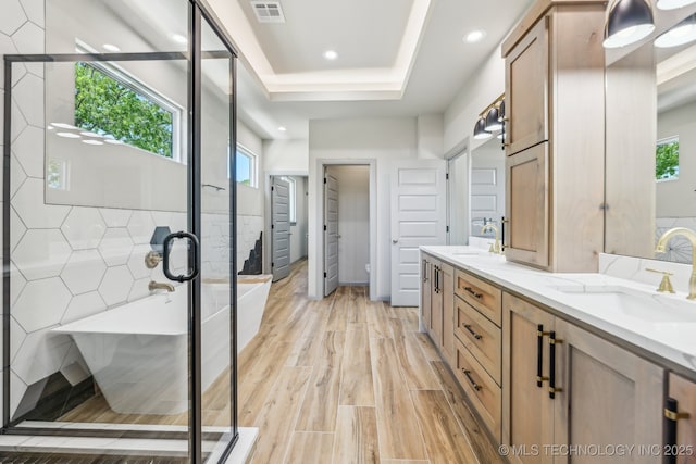 425 W Ft Worth St, Broken Arrow, OK 74012 - bathroom featuring a soaking tub, a sink, double vanity, visible vents, and a shower stall
