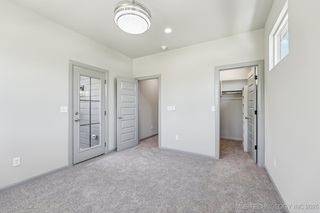 425 W Ft Worth St, Broken Arrow, OK 74012 - unfurnished bedroom featuring a spacious closet, carpet flooring, and baseboards