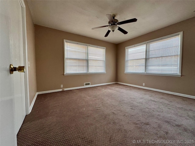 unfurnished room featuring ceiling fan and carpet flooring