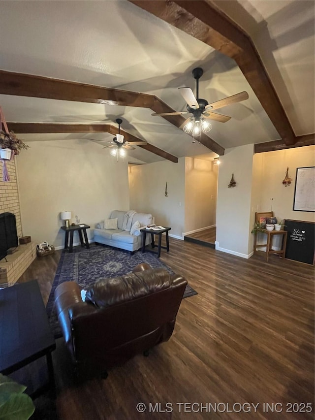 living room with beamed ceiling, a fireplace, and dark wood-type flooring