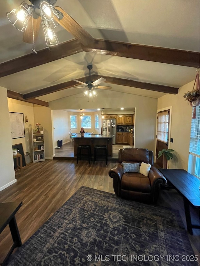 living room featuring vaulted ceiling with beams and dark wood-type flooring