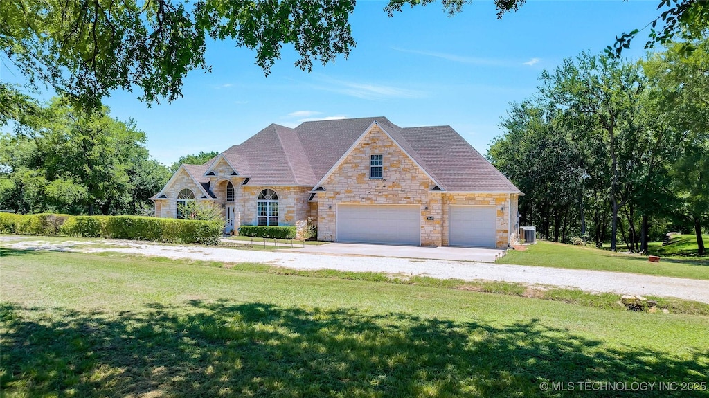 view of front of home with a front lawn and cooling unit