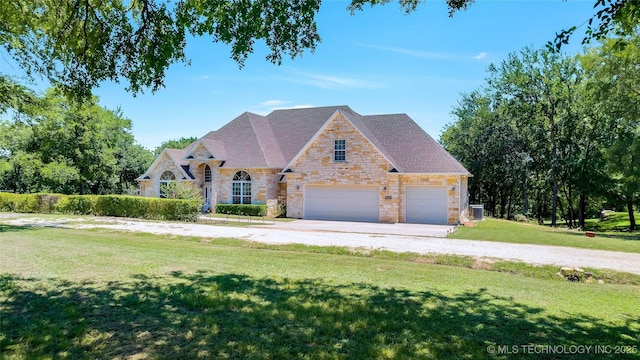 view of front of home with a front lawn and cooling unit