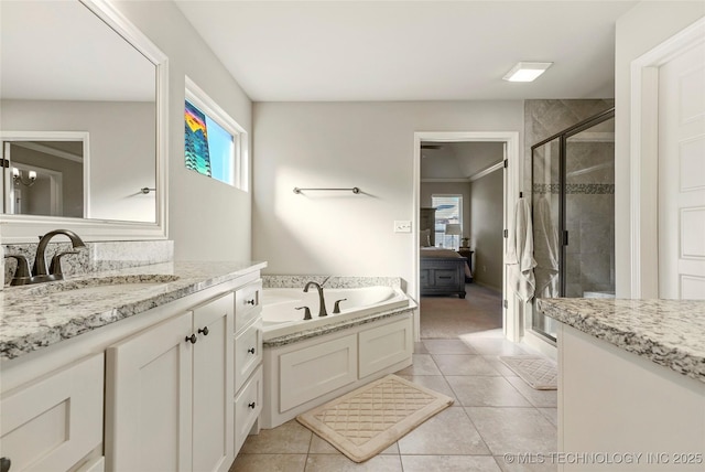 bathroom featuring tile patterned floors, vanity, and independent shower and bath