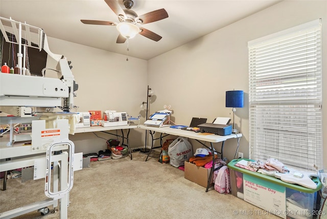 office area featuring ceiling fan and light colored carpet