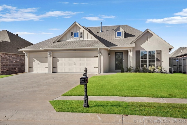 view of front of home featuring a garage and a front lawn