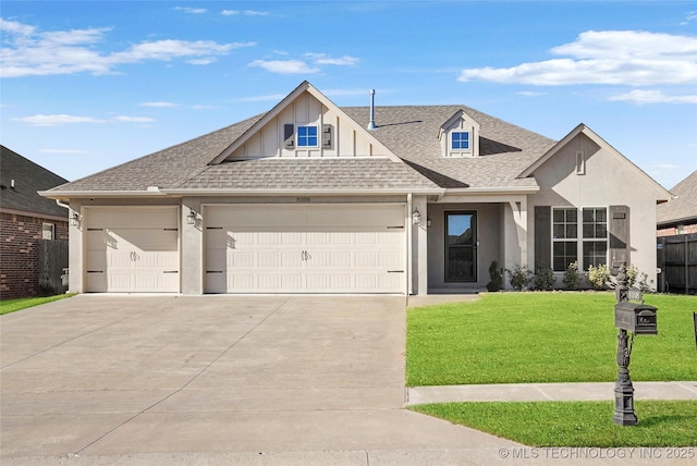 view of front of property with a front yard and a garage