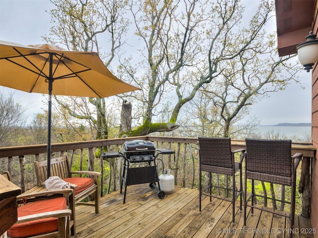 wooden deck featuring grilling area