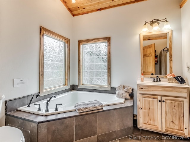 bathroom featuring vanity, lofted ceiling, wooden ceiling, a relaxing tiled tub, and toilet