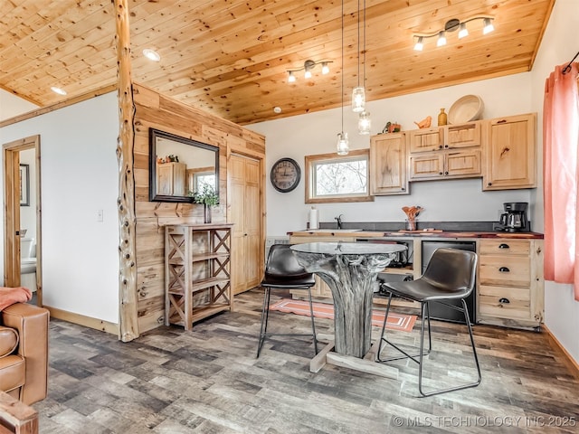 kitchen featuring lofted ceiling, light brown cabinets, wood ceiling, and decorative light fixtures