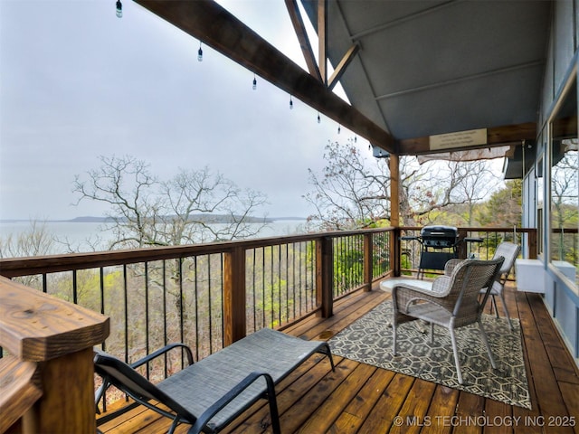 wooden terrace featuring grilling area