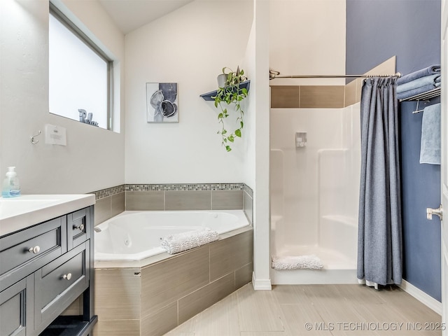 bathroom with plus walk in shower and vanity