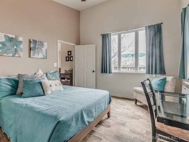 bedroom with light hardwood / wood-style floors