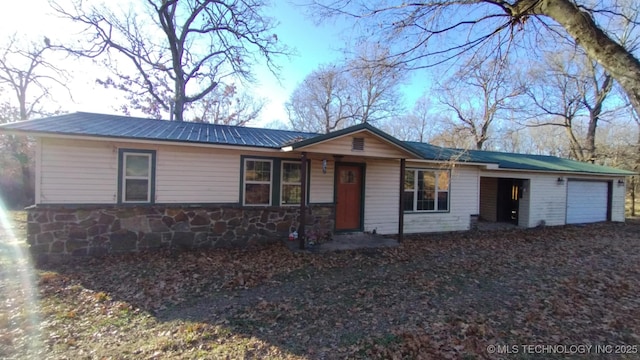 single story home with a garage