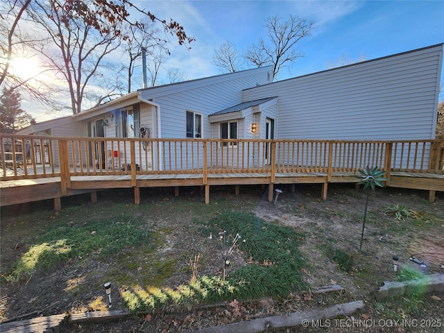 rear view of house with a deck