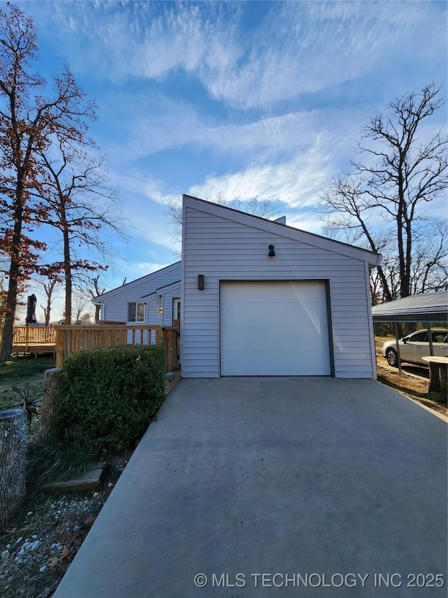 garage featuring a carport