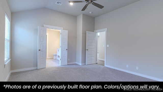 unfurnished bedroom featuring ceiling fan, lofted ceiling, light carpet, and ensuite bath