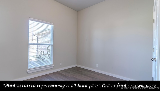 spare room with hardwood / wood-style flooring