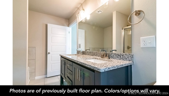 bathroom featuring a shower, vanity, and tile patterned floors