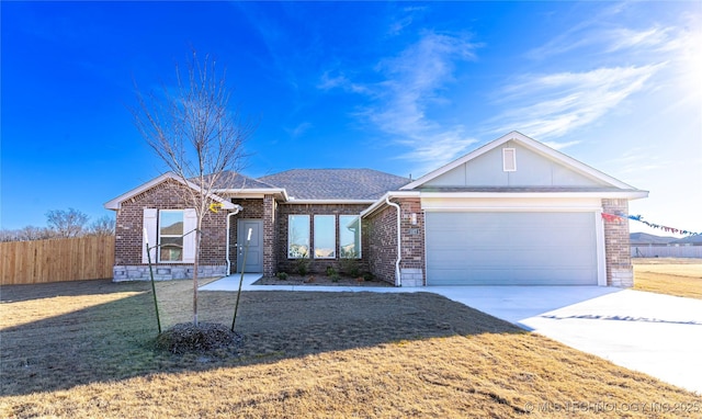 ranch-style home with a front lawn and a garage