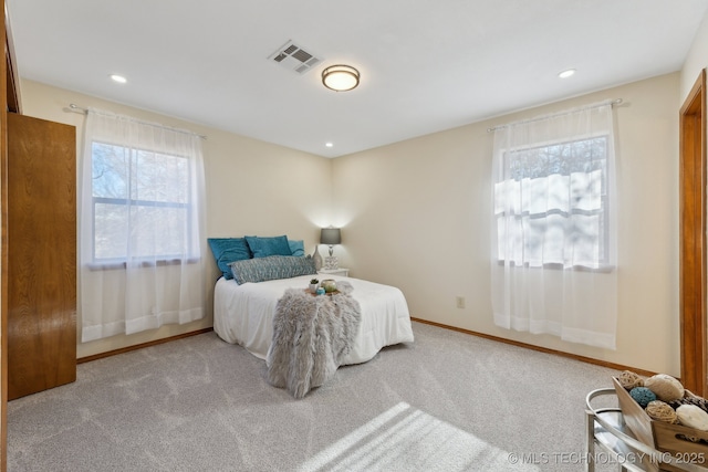 bedroom with light colored carpet